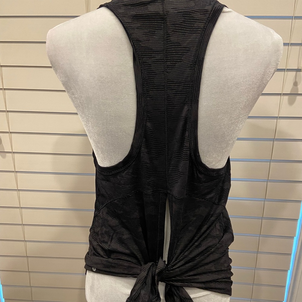 Lululemon black-camo print, high-neck, tie back tank. Size 8.